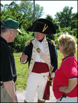 Photo: Dr. Hal Stearns (portraying William Clark in later life) chats with two admirers at the Independence Creek encampment.