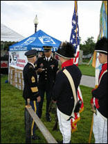 Photo: Several of the Non-Commissioned Officers from The Old Guard who accompanied the Fife and Drum Corps chat with the Soldiers who compose the U.S. Army Official 1802 Lewis and Clark Color Guard.