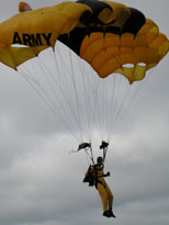 Photo: An Army jumper slows just prior to landing directly atop a ground marker during a precision jump demonstration. The Golden Knights’ parachute competition teams, Style and Accuracy team, and the eight-way formation skydiving team, have circled the globe competing in parachuting competitions.  Their professional credentials include 20 national and six world team titles. In addition to those accomplishments the Golden Knights can claim having the only six-time world champion parachutist in formation skydiving. These impressive achievements have made them not only the most successful U.S. Department of Defense sports team, but also the most successful parachute team in the world.