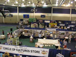 Photo: Exhibitors set up their booths in the field house.