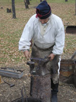 Photo: The forge employed a hand pumped bellows to heat up a fire.  