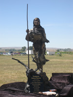 Photo:  A very striking statue of Sacagawea created by artist Carol A. Grende.  The sculpture is named “Sacajawea’s Arduous Journey.” It portrays the native girl stepping up a hill, a long staff in her hand and the baby nicknamed “Pomp” by William Clark is strapped to her back.