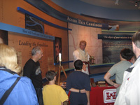 Photo:  A reenactor portraying Captain William Clark, who made the maps on the expedition, demonstrates the use of a sextant and surveying equipment like those used by the Corps of Discovery, at the Visitors Center/ Museum at the Lewis and Clark State Historic Site.
