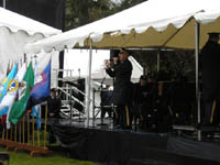 Photo: Chief Warrant Officer 4 Jim Powell treats the crowd to a rendition of Lee Greenwood's "Proud to be an American".