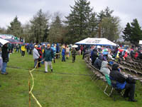 Photo: The extremely wet weather did not deter a large crowd from coming out to see the VIPs who made up the official part of the opening ceremony.  The dignitaries included the Governors of Washington State and Oregon, members of the Oregon legislature, the Commanding General of the U.S. Army Corps of Engineers, and The Adjutant Generals of the Washington State and Oregon National Guard.