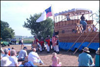 Photo: The 'Lewis and Clark Fife and Drum Corps' performing by the replica keelboat at the Lewis and Clark Bicentennial Commemoration, Fort Atkinson Corps of Discovery Festival, in Fort Calhoun, Nebraska, July 31-August 3, 2004.  The Corps, a youth group, authentically interprets the music, drill and uniforms of U.S. Army musicians during the Jefferson administration.
