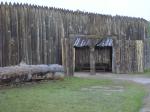 Photo: Front gate of Fort Mandan with partially completed log canoe.