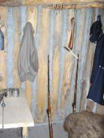 Photo: Muskets and equipment stacked for ready use in the guardroom.