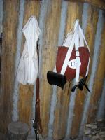 Photo: Field pack and musket hung on the wall of the guard room at Fort Mandan.