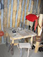 Photo: Roughly hewn wooden table in the enlisted men’s quarters at Fort Mandan.
