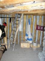 Photo: Interior of enlisted quarters - note the white and blue “field jacket” (winter coat) hanging on the wall. 