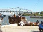 Photo: Replica keelboat approaches reviewing stand at Waterfront Park.
