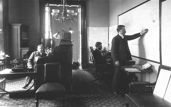 Photo:  White House communications center during the War with Spain.  Captain Montgomery is seated at left.