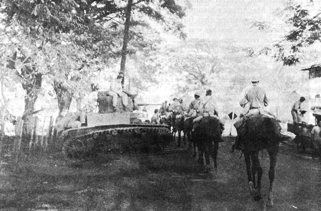 Photo:  26th Cavalry (PS) moving into Pozorrubio pass a General Stuart light tank, M3