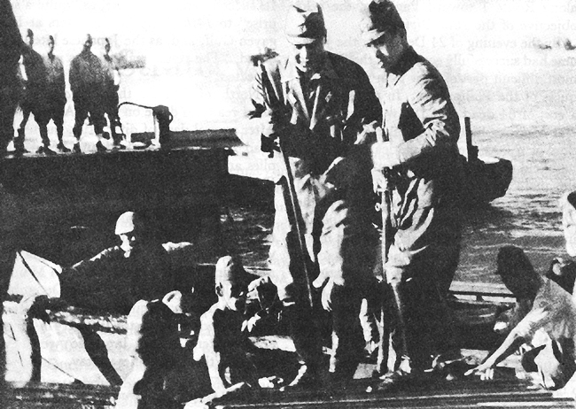 Photo:  Lt. Gen. Masaharu Homma, 14th Army Commander, coming ashore at Lingayen Gulf, 24 December 1941