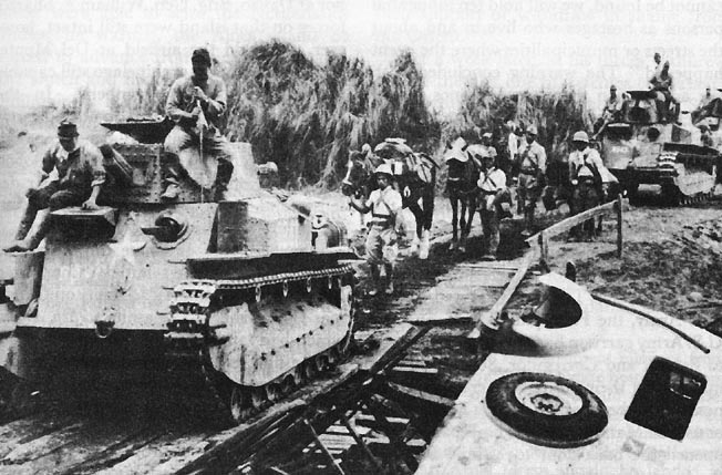 Photo:  Japanese light tanks moving toward Manila on the day the city was entered