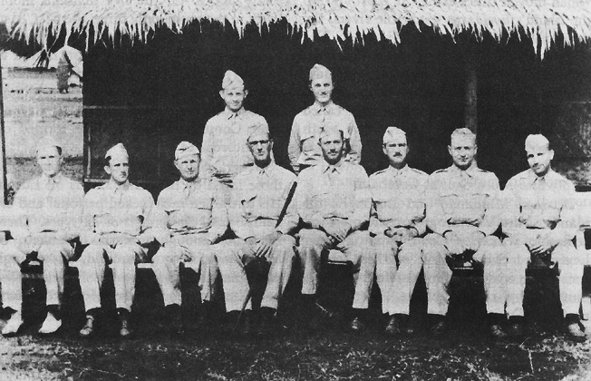 Photo:  MAJ. GEN. WILLIAM F. SHARP AND HIS STAFF, 1942. Back row, standing left to right: Maj. Paul D. Phillips (ADC) and Capt. W. F. O'Brien (ADC). Front row, sitting left to right: Lt. Col. W. S. Robinson (G-3), Lt. Col. Robert D. Johnston (G-4), Col. John W. Thompson ( C o f S ) , General Sharp (CG), Col. Archibald M. Mixson ( D C o f S ) , Lt. Col. Howard R. Perry, Jr. (G-1), Lt. Col. Charles I. Humber (G-2), and Maj. Max Weil (Hq Comdt and PM).