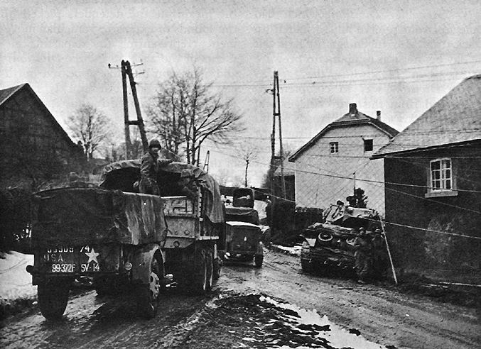 Photo:  99th Division vehicles moving through Wirtzfeld en route to Elsenborn.