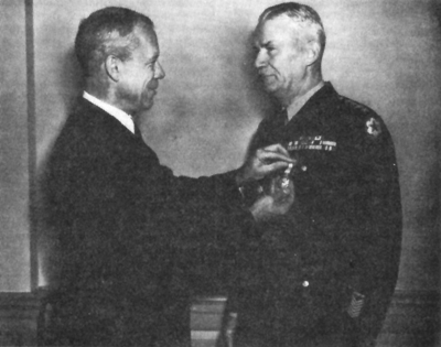 Picture : SECRETARY OF WAR ROBERT P. PATERSON decorating General Somervell for distinguished service, October 1945