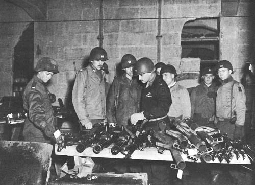 Photo:  Colonel Medaris examining captured German weapons