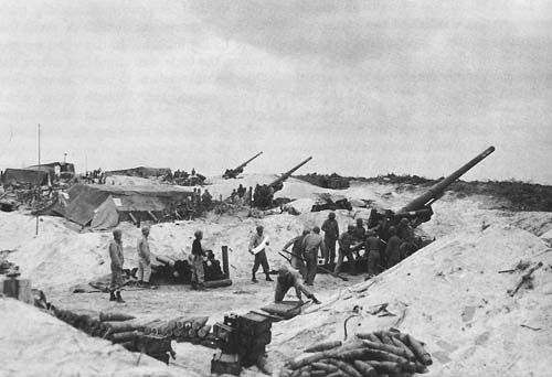 Photo:  Preparing Long Toms to fire on Okinawa from Keise Shima