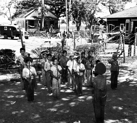 Photo: JAPANESE CHILDREN DRILLING In American service caps, Hawaii,
