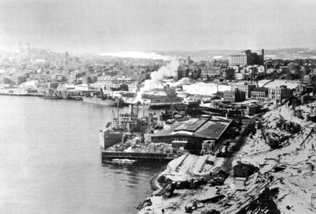 Photo: INSTALLATIONS IN NEWFOUNDLAND. U.S. Army .supply dock, St. John's harbor.