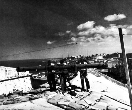 Photo: OPTICAL HEIGHT FINDER MOUNTED ON OLD EL MORRO FORTRESS, San Juan, Puerto Rico. U.S. Army post is visible in background.