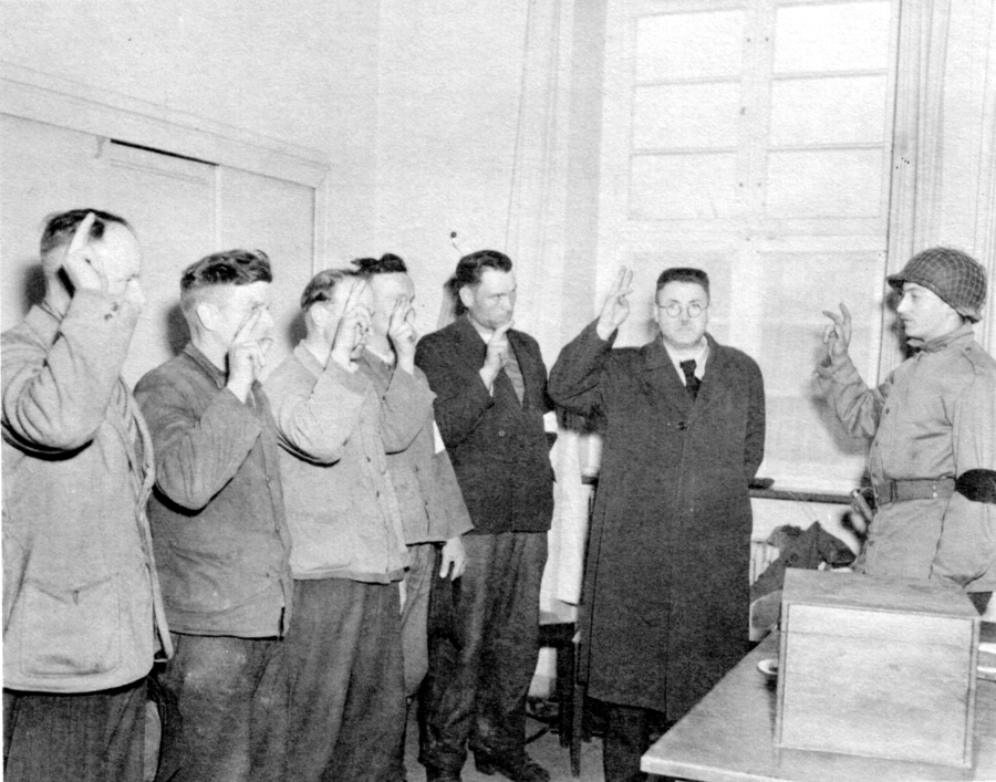 U.S. OFFICER SWEARS IN A BUERGERMEISTER AND FIVE POLICEMEN
