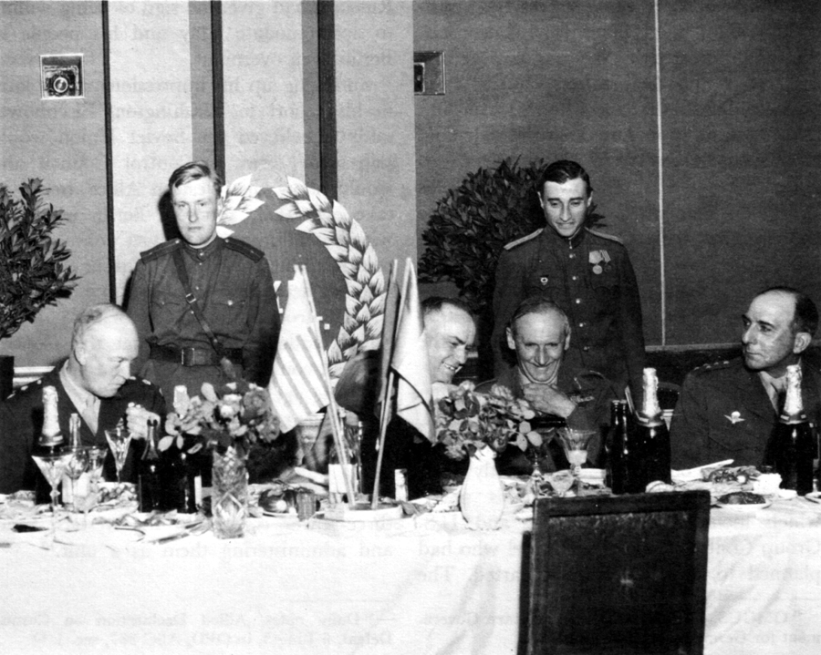 MARSHAL ZHUKOV (Center) POURS A TOAST at the 5 June 1945 meeting in Berlin. General Eisenhower (left) departed immediately after the toast. On. the right are Field Marshal Montgomery and General de Lattre de Tassigny.