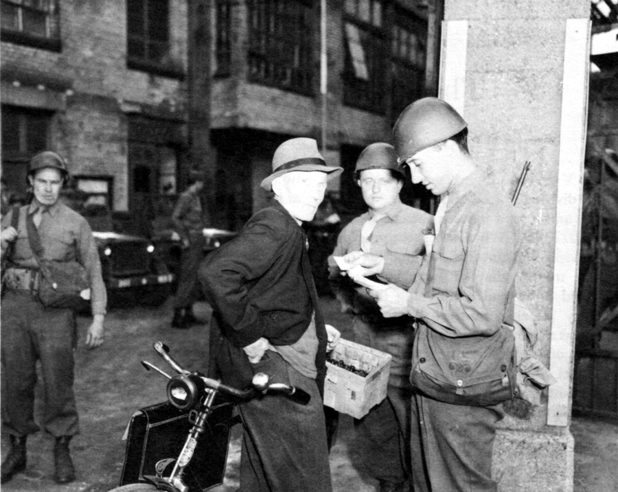 SOLDIERS CHECK PAPERS OF A CIVILIAN