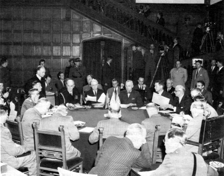 SESSION AT POTSDAM. President Truman is at the far side of the table with Secretary Byrnes and Admiral Leahy on his right.