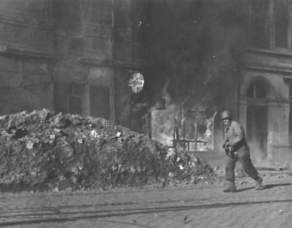 Photo: Rifleman in burning Aachen.