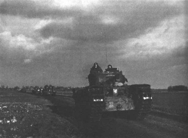 Photo: Column of British Churchhill Tanks on a road near Geilenkirchen.