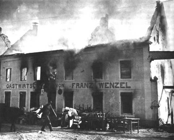 Photo: Wallendorf Civilians strive to save their belongings from the burning town after German troops have left.