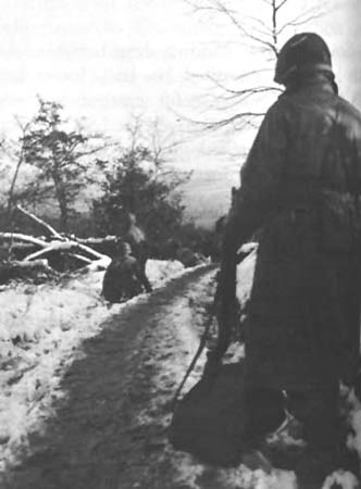 Photo: Men of the 331st Infantry advance on Gey. 