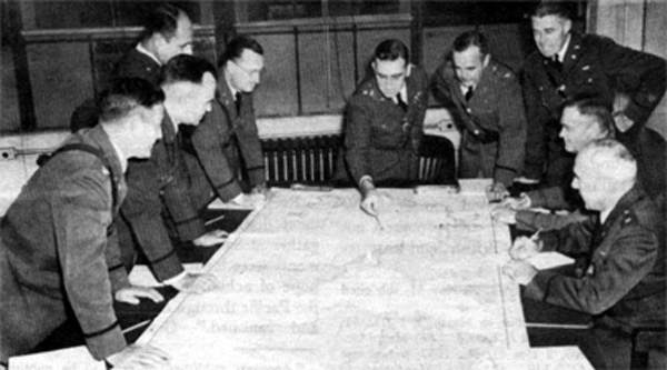 Photo - MEMBERS OF THE WAR PLANS DIVISION Left to right: Col. Lee S. Gerow, Col. C. W. Bundy, Lt. Col. M. B. Ridgaway, Brig. Gen. H. F. Loomis, Brig. Gen. Leonard T. Gerow, Col. R. W. Crawford, Lt. Col. S. H. Sherrill, Col. T. 7'. Handy, and Lt. Col. C. A. Russell.