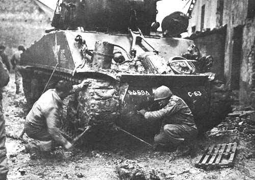 Photo:  Replacing tracks on a Sherman tank