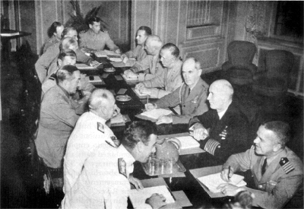 MEMBERS OF U.S. AND BRITISH STAFFS CONFERRING, Quebec, 23 August 1943. Seated around the table from left foreground: vice Adm. Lord Louis Mountbatten, Sir Dudley Pound, Sir Alan Brooke, Sir Charles Portal, Sir John Dill, Lt. Gen. Sir Hastings L. Ismay, Brigadier Harold Redman, Comdr. R. D. Coleridge, Brig. Gen. John R. Deane, General Arnold, General Marshall, Admiral William D. Leahy, Admiral King, and Capt. F. B. Royal. 