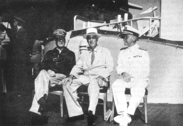 PRESIDENT ROOSEVELT DURING PEARL HARBOR CONFERENCE. General MacArthur and Admiral Chester W. Nimitz on deck of the USS Baltimore with the President, July 1944.