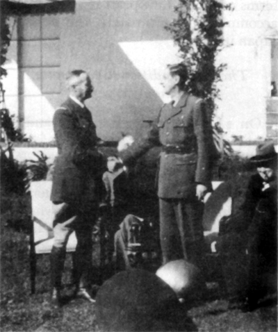 GENERALS HENRI GIRAUD AND CHARLES DE GAULLE shaking hands for the photographers.
