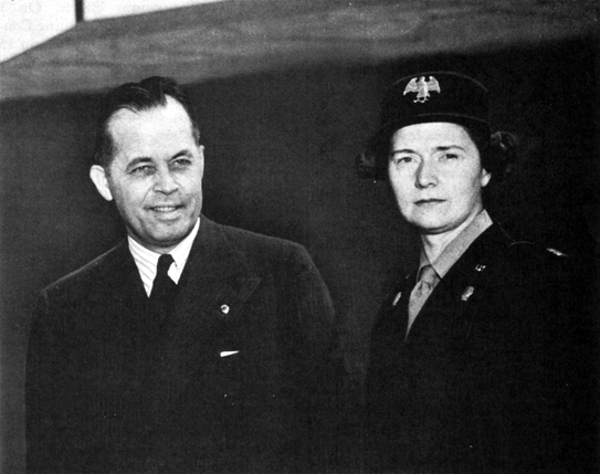 FIRST OFFICER ELIZABETH H. STRAYHORN, of the Fifth WAAC Training Center, with Governor Sam ones of Louisiana, a visitor on the post.
