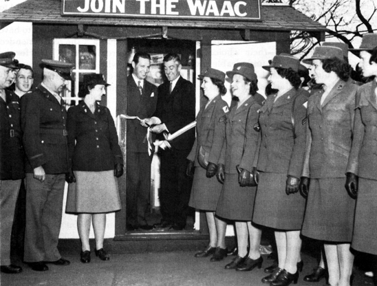 ALL-STATES RECRUITING CAMPAIGN. Governor Leverett Saltonstall of Massachusetts cuts the ribbon opening a WAC recruiting booth. Standing next to the Governor is Mayor Maurice J. Tobin of Boston.
