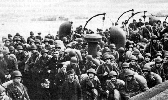 DOCKING IN SCOTLAND. Advance party of WAAC officers and enlisted women are greeted by a bagpipe band upon their arrival, 11 May 1943.