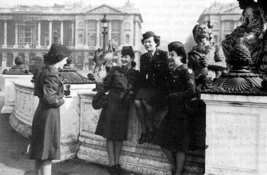 ON LEAVE IN PARIS, 1945, Note of-duty dresses, above, and battle jackets (left), below, worn by the women.