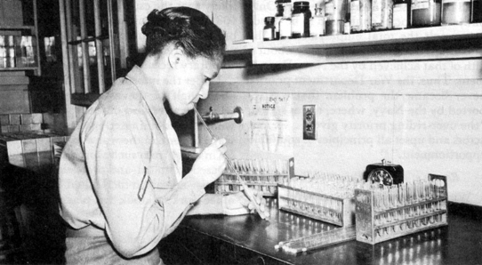 SUITABLE ARMY JOBS FOR WOMEN. Wac laboratory technician conducts an experiment at Fort Jackson Station Hospital, South Carolina. 