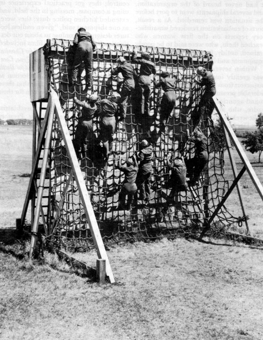 OVERSEAS TRAINING. Women practice going down a cargo net at Fort Des Moines.