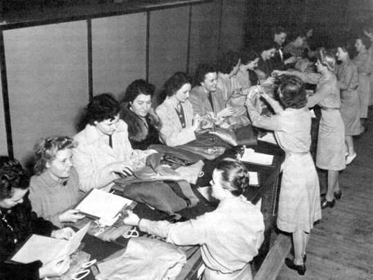 PROCESSING AT TRAINING CENTERS. New recruits are given a clothing issue at the warehouse, Daytona Beach.