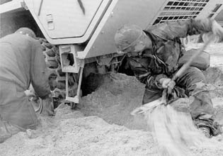 1st Armored Division Soldiers Digging Out a Heavy Equipment Transporter