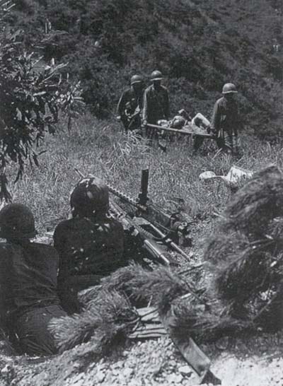 Medics evacuate wounded of the 5th Regimental Combat Team hit near Masan, 30 August, 1950.